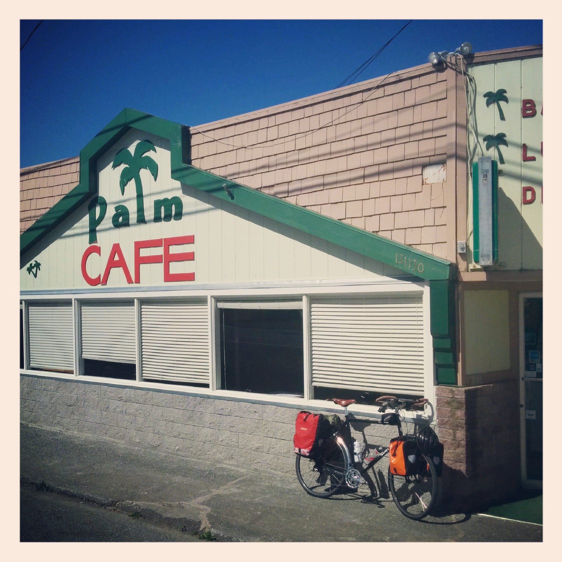 After a long trip through the Redwoods I was ready for breakfast. And right about the 20 mile mark I hit Orick and stopped here at the Palm Cafe.
As I was going in I ran into these two young dudes that were doing a test run on their motorcycles for a North American loop their going to do. They were really nice and we chatted about traveling and what not. I wished them luck they did the same and set off.